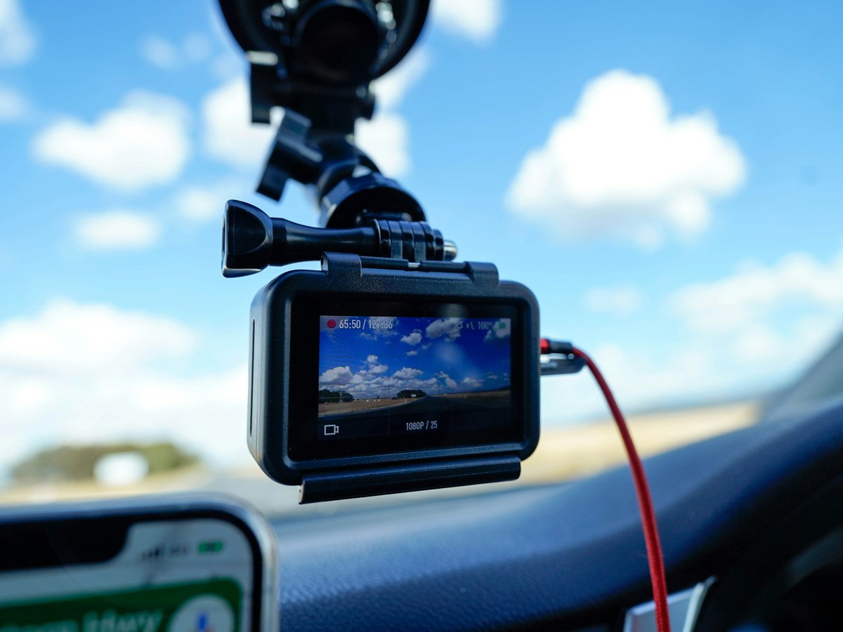 Camera mounted on a vehicle windscreen with a suction mount